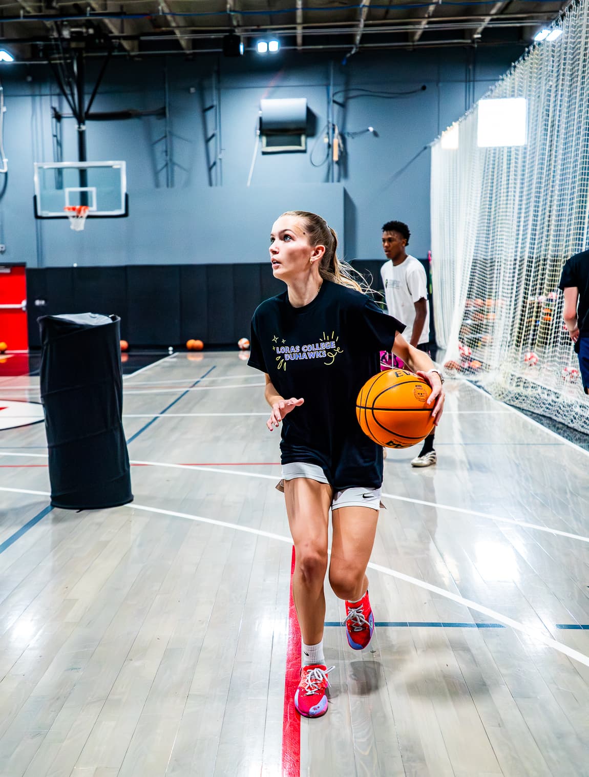 high school basketball player dribbling