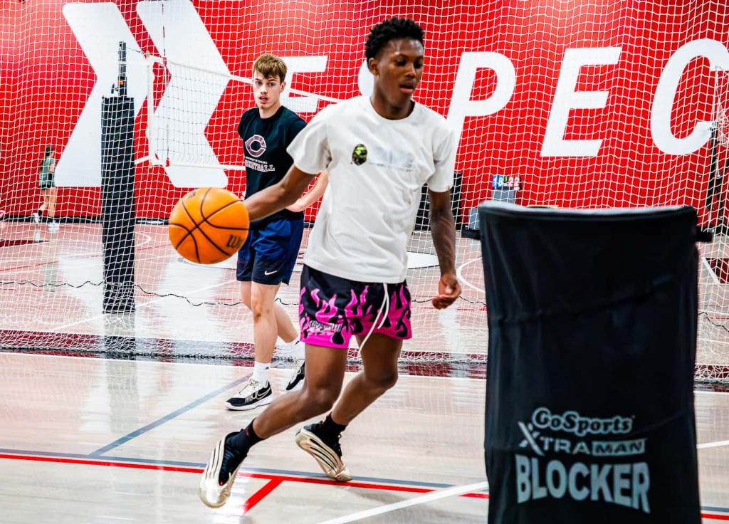 high school basketball player dribbling