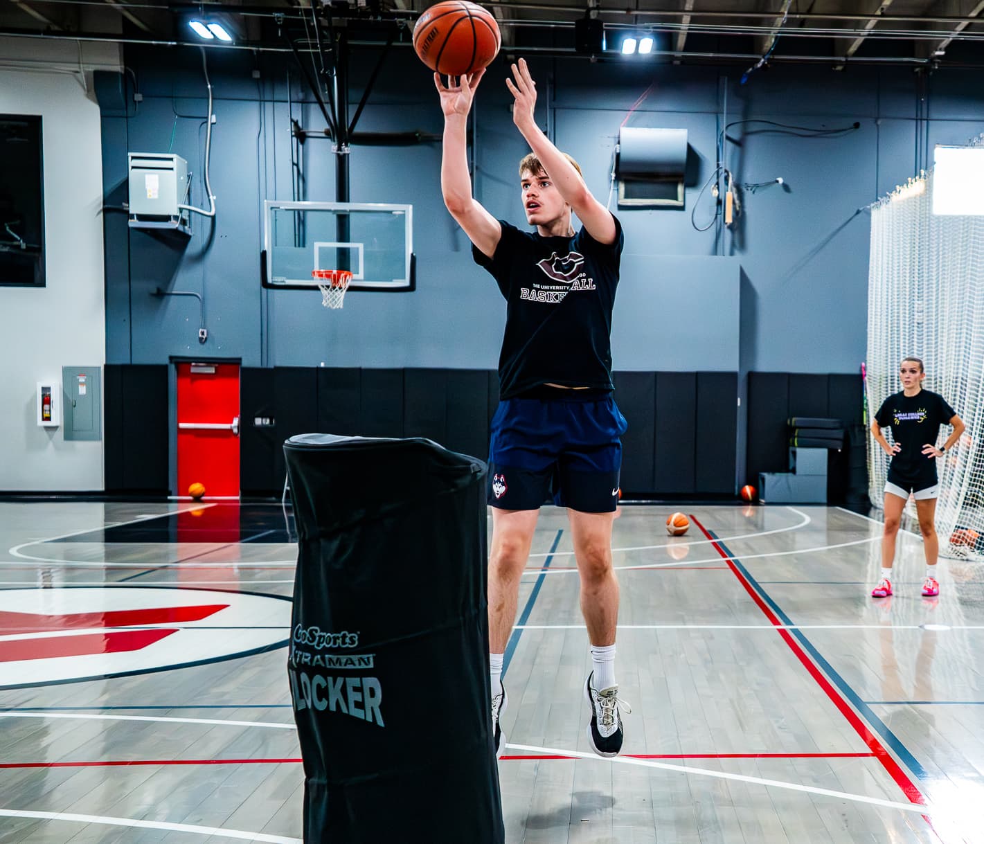 high school basketball player shooting jump shot