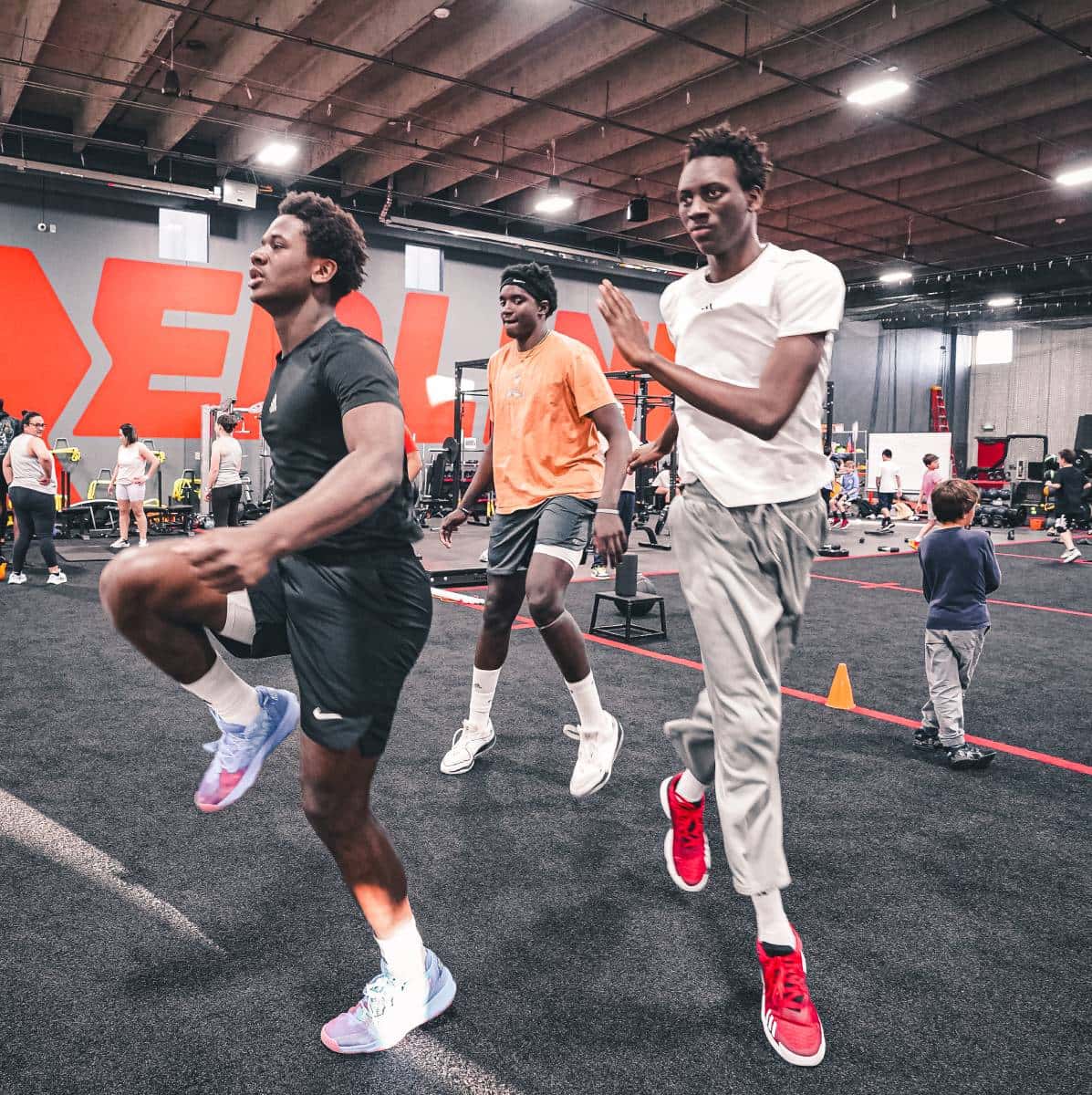 high school athletes perform karaoke stretching