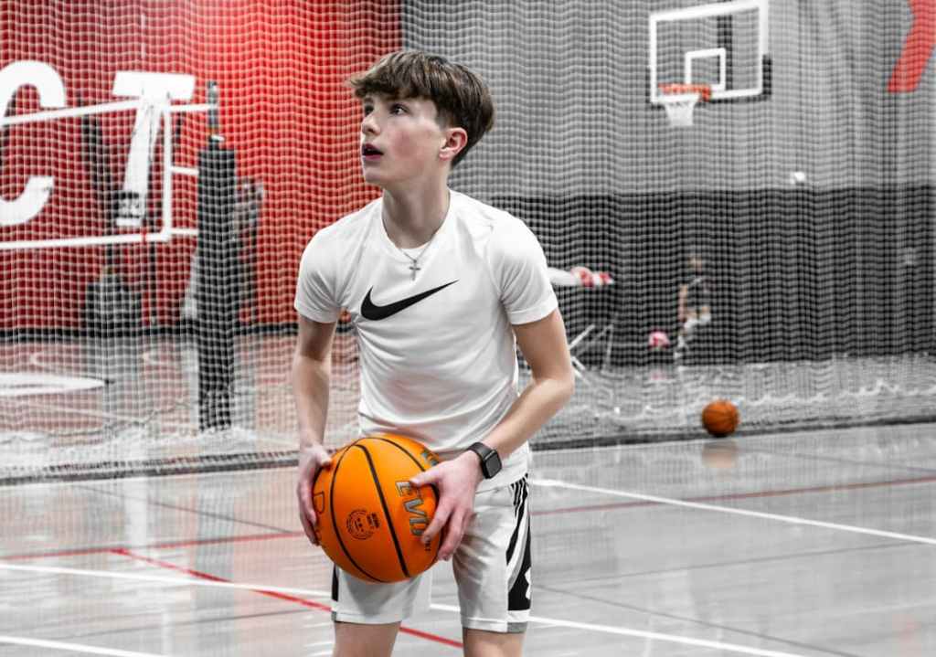 youth athlete shooting a basketball