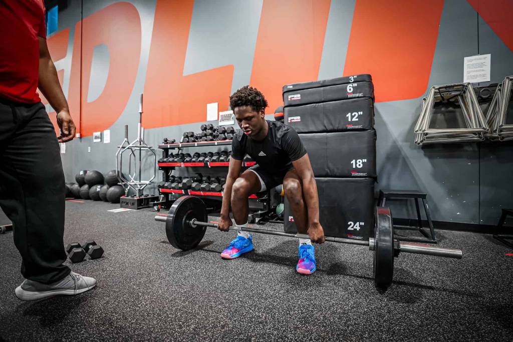 athlete deadlifting